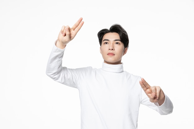 Handsome Asian man in a white sweater