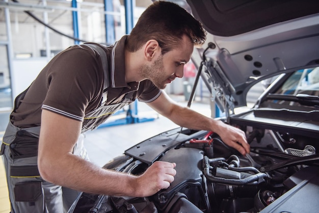 Handsome auto service worker