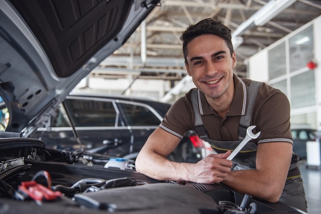 Handsome auto service worker