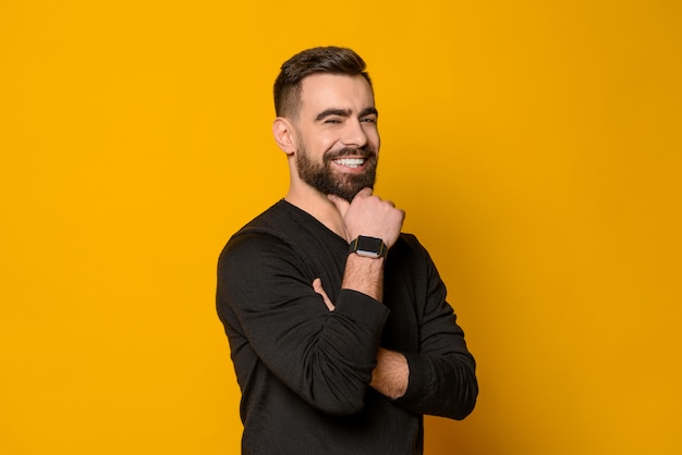 Handsome bearded confident man smiling isolated