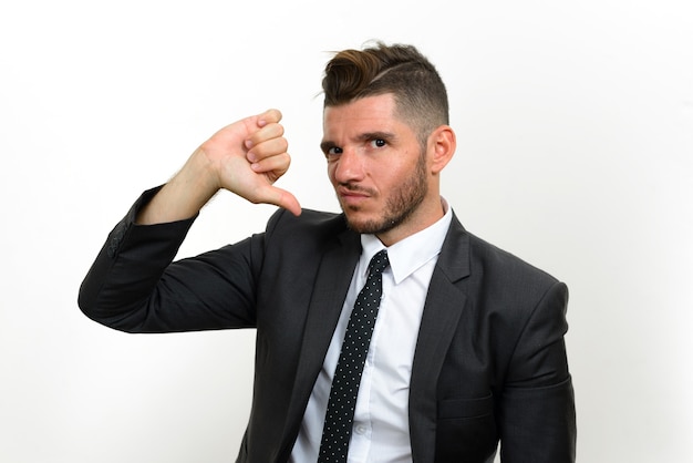 handsome bearded Hispanic businessman wearing suit on white