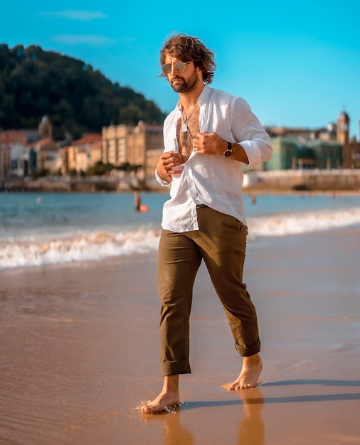 Handsome bearded man at the beach