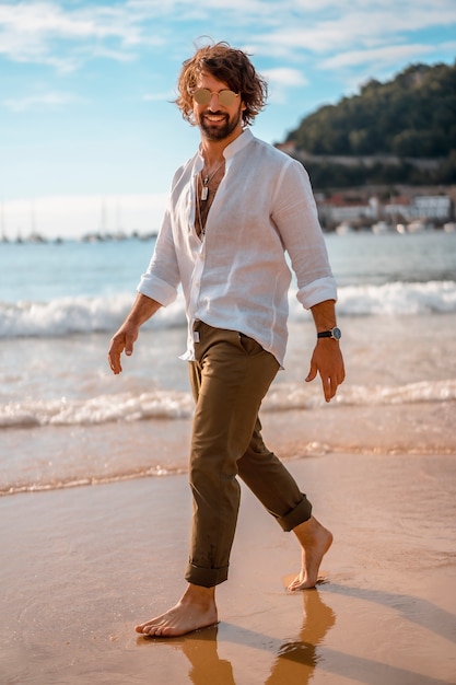 Handsome bearded man at the beach