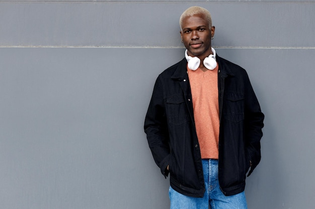 handsome black man with headphones portrait outdoor