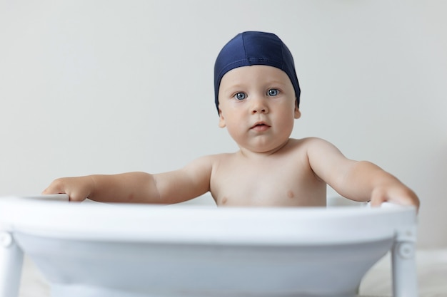 Handsome boy preschooler bathing in the bathroom