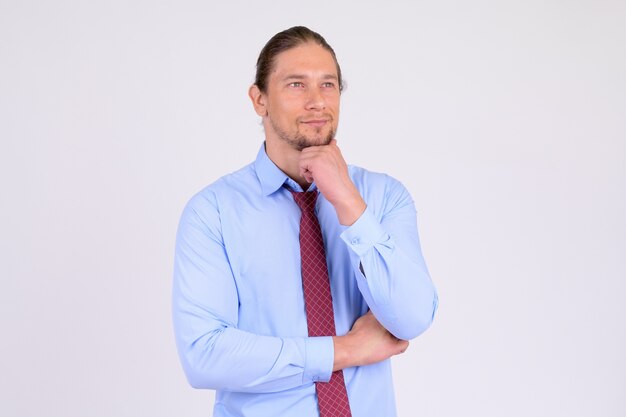  handsome businessman against white wall