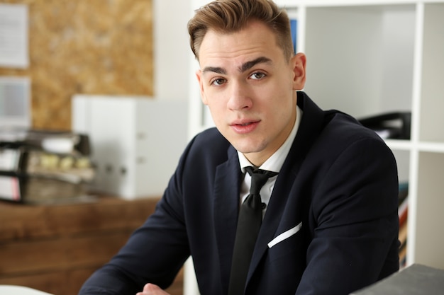 Handsome businessman in suit  at workplace