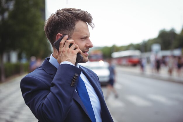 Handsome businessman talking on mobile phone