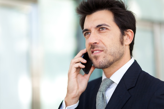 Handsome businessman talking on the mobile phone