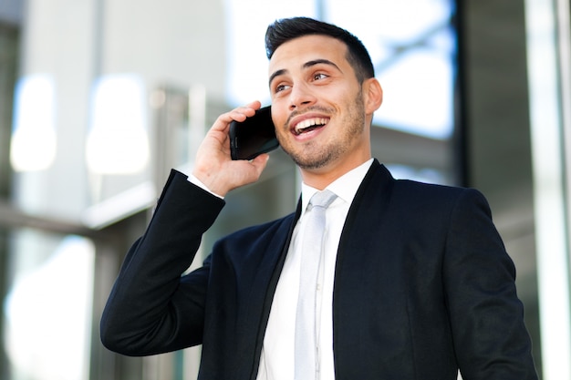 Handsome businessman talking on the mobile phone