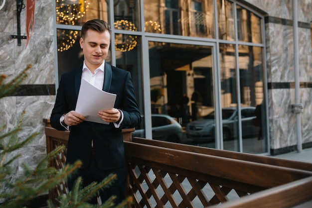 Handsome businessman on a terrace