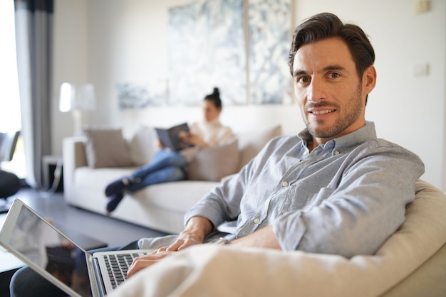  Handsome caucasian man with computer and wife 