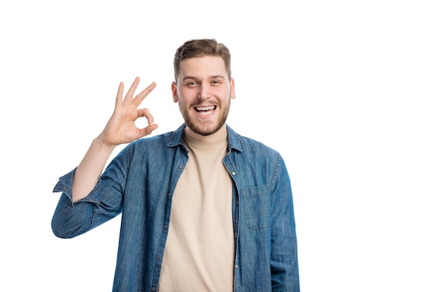 Handsome cheerful man in trendy denim