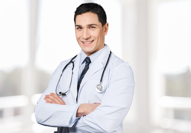 Handsome doctor portrait on background