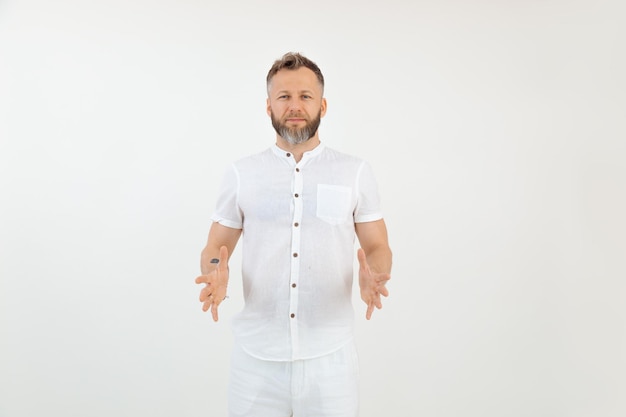 Handsome friendly businessman in white outfit isolated background empty template for advertise hold