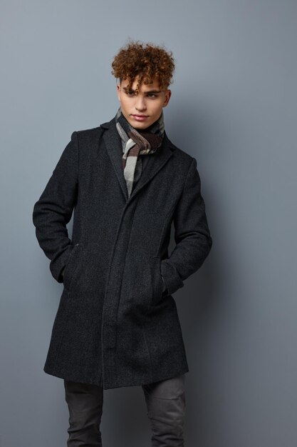 Handsome guy Black coat posing fashion Lifestyle unaltered