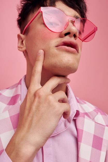 Handsome guy pink glasses checkered jacket fashion posing Lifestyle unaltered