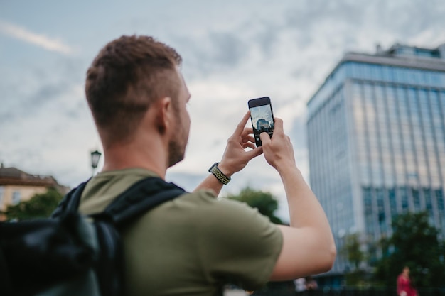 Handsome hipster man walking in street