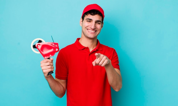 Handsome hispanic man pointing at camera choosing you packer concept