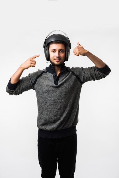 Handsome Indian asian man in helmet over white background with different expressions