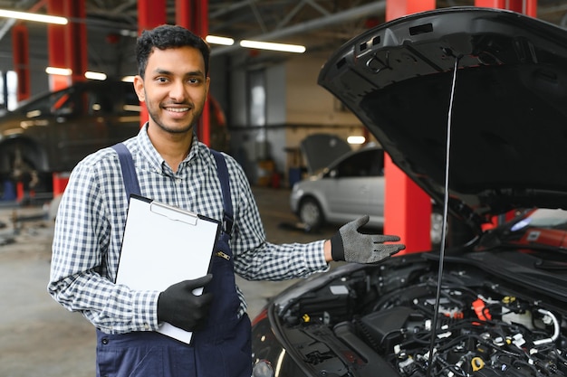 Handsome Indian Auto Mechanic at car servise