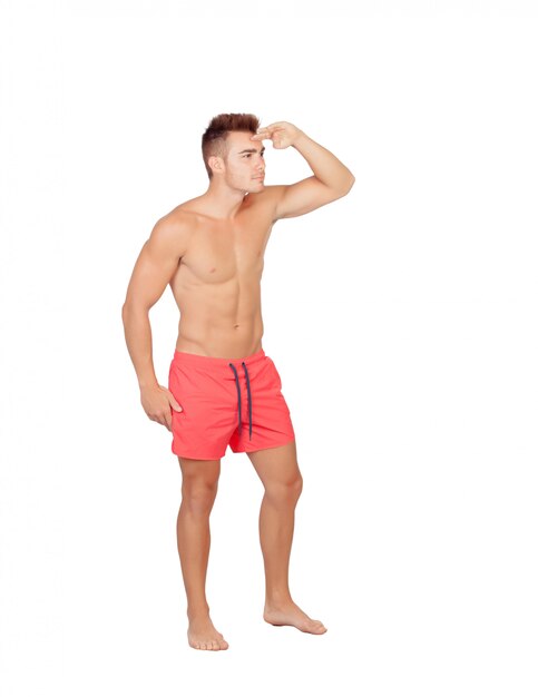 Handsome lifeguard with red swimsuit