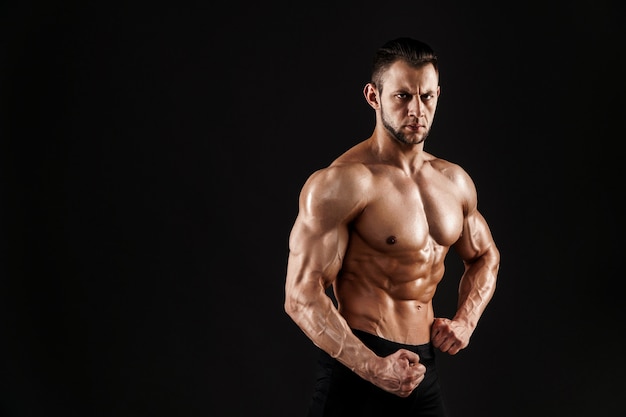 Handsome male model posing at studio.