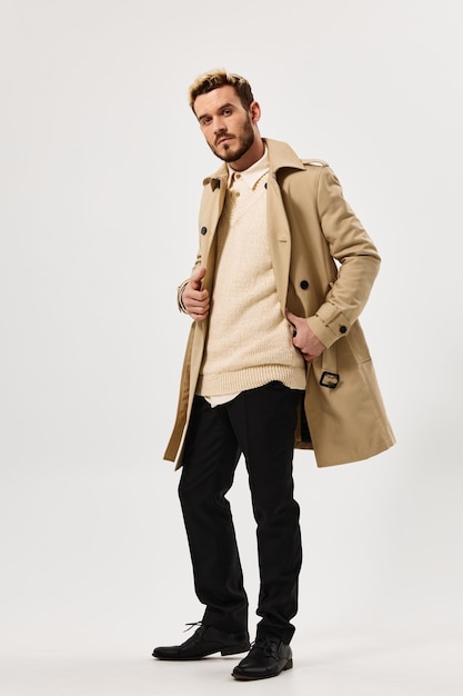 Handsome man in beige coat fashion attractive look full length