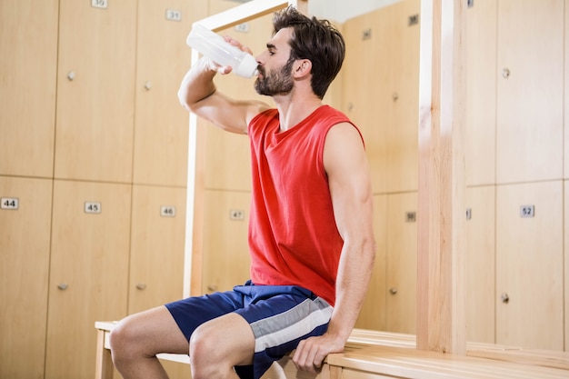 Handsome man drinking water 