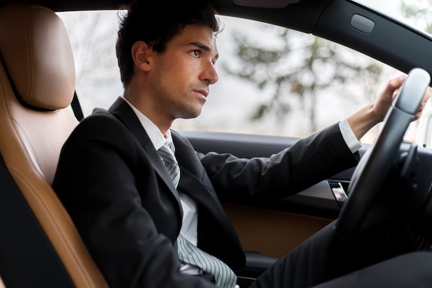 Handsome man driving his car