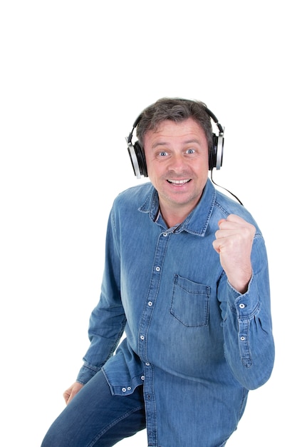 Handsome man enjoying listening to music isolated on white