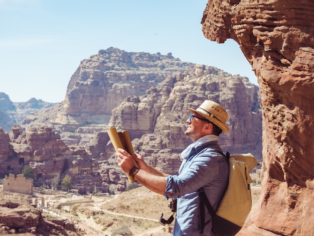 Handsome man, exploring the sights of of Petra