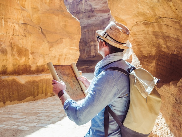 Handsome man, exploring the sights of of Petra