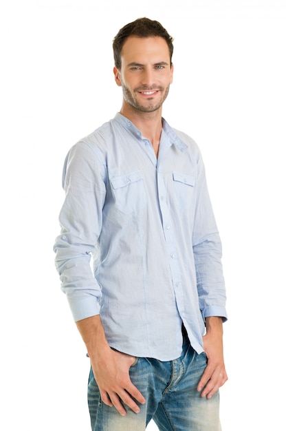 Handsome Man Standing Casually Dressed Against White Background
