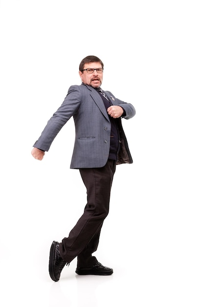 Handsome man in suit and glasses dancing white background