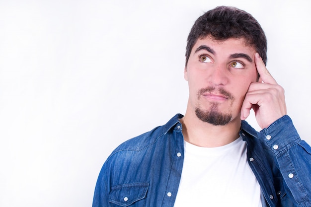 Handsome man thinking and looking on the side isolated  copy space