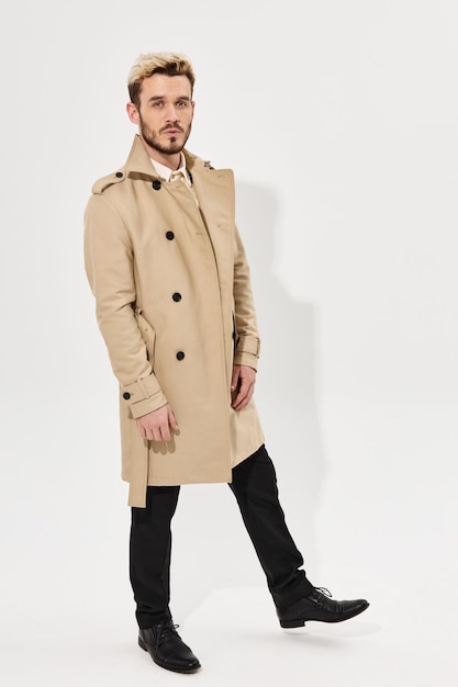 Handsome man trendy hairstyle coat modern style full length