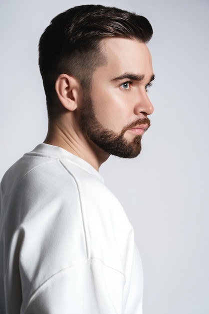 Handsome man wearing white sweatshirt