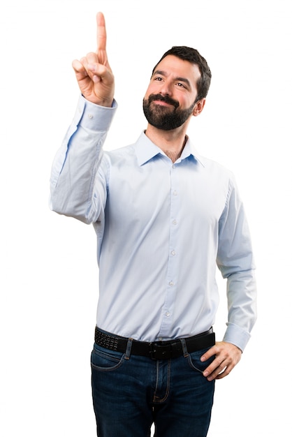 Handsome man with beard touching on transparent screen