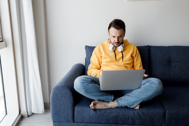 handsome man with laptop at home