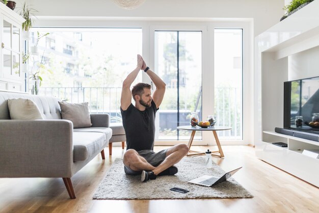 Handsome man working out at home