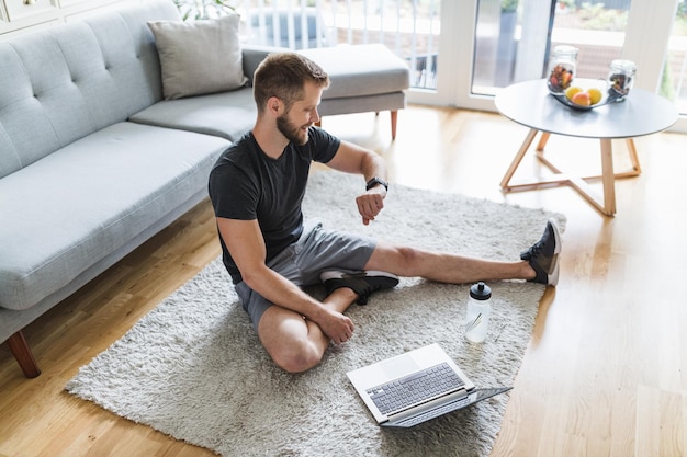 Handsome man working out at home