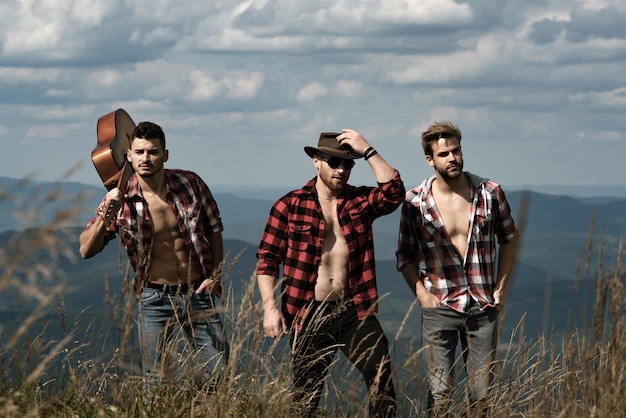 Handsome men walking in the mountains.