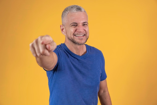 Handsome middle age hoary senior man over isolated background Pointing to you and the camera with fingers smiling positive and cheerful