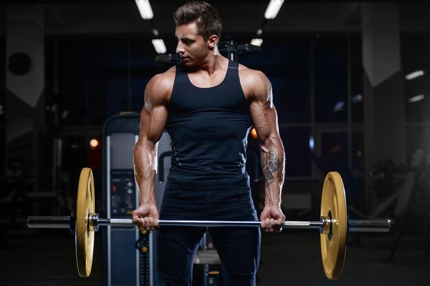 Handsome model young man workout in gym