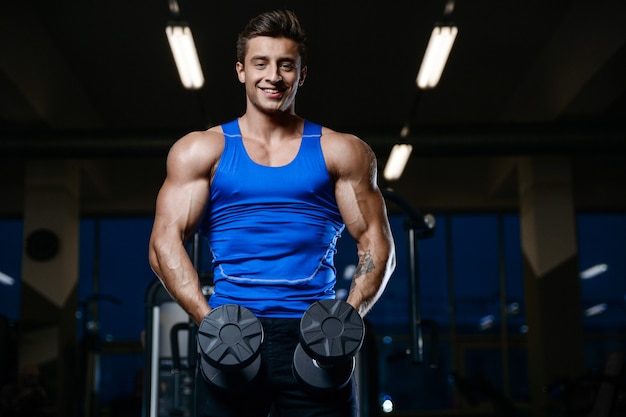 Handsome model young man workout in gym