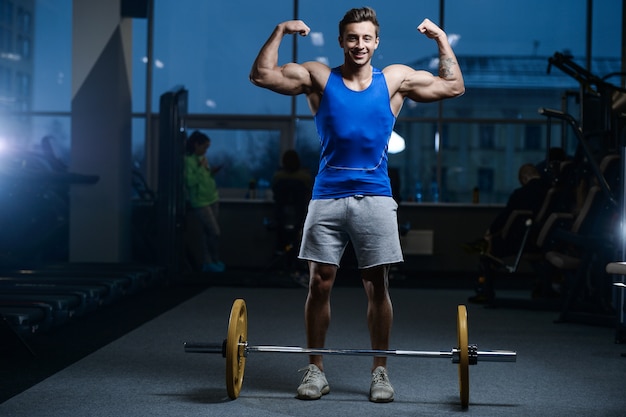 Handsome model young man workout in gym