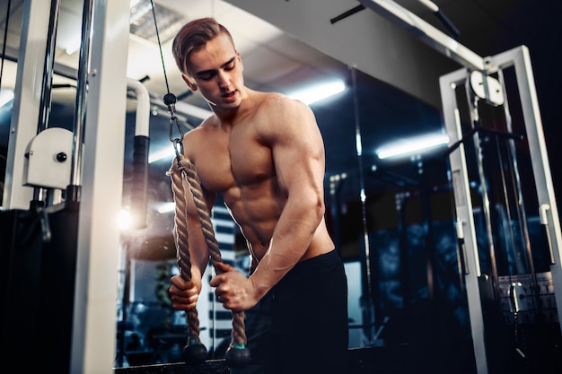 Handsome Muscular Fitness Bodybuilder Doing Heavy Weight Exercise For Triceps