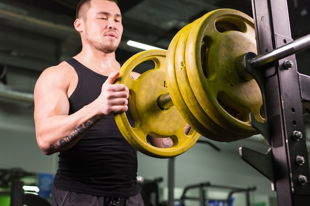 Handsome Muscular Man in gym close up