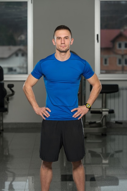 Handsome Personal Trainer Wearing Sportswear In Fitness Center